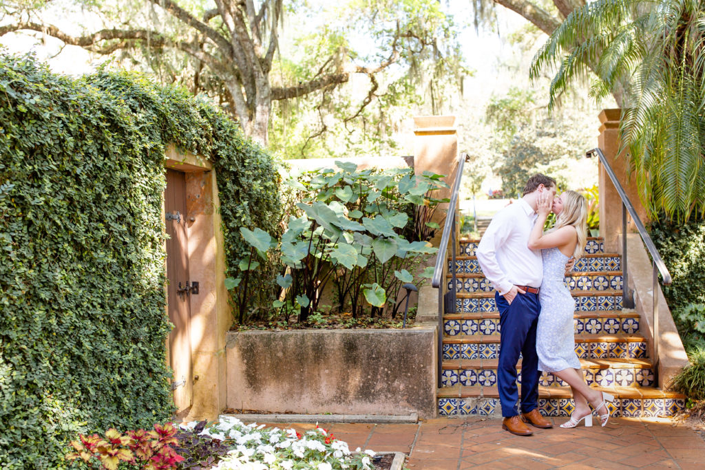 Bok Tower Gardens engagement photo of the couple kissing in front of the staircase