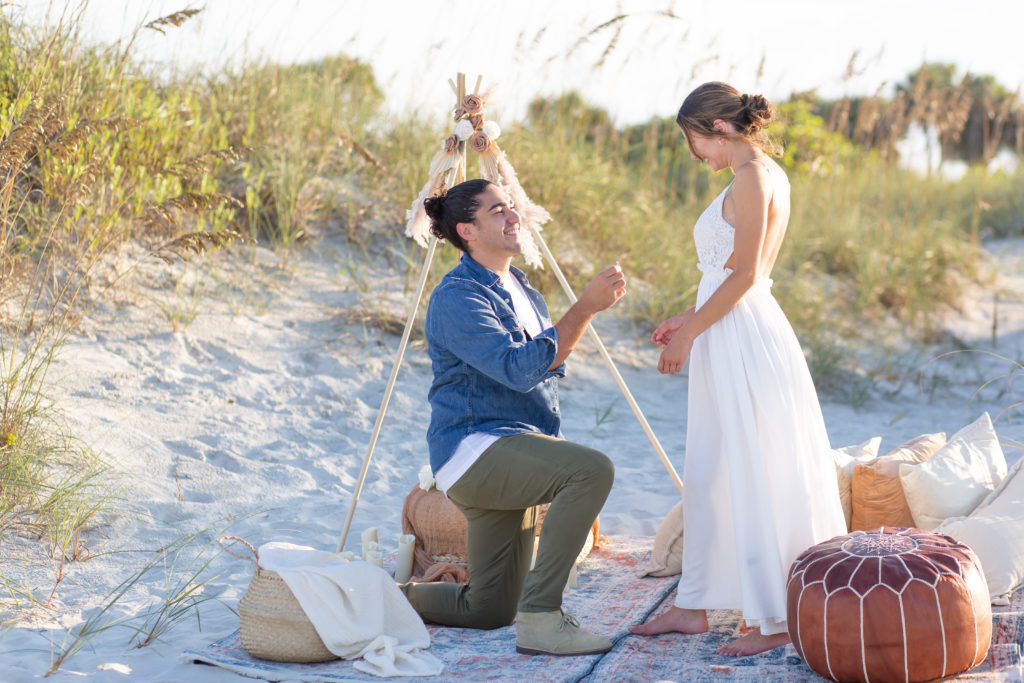 Picnic proposal with a boho setup on the beach
