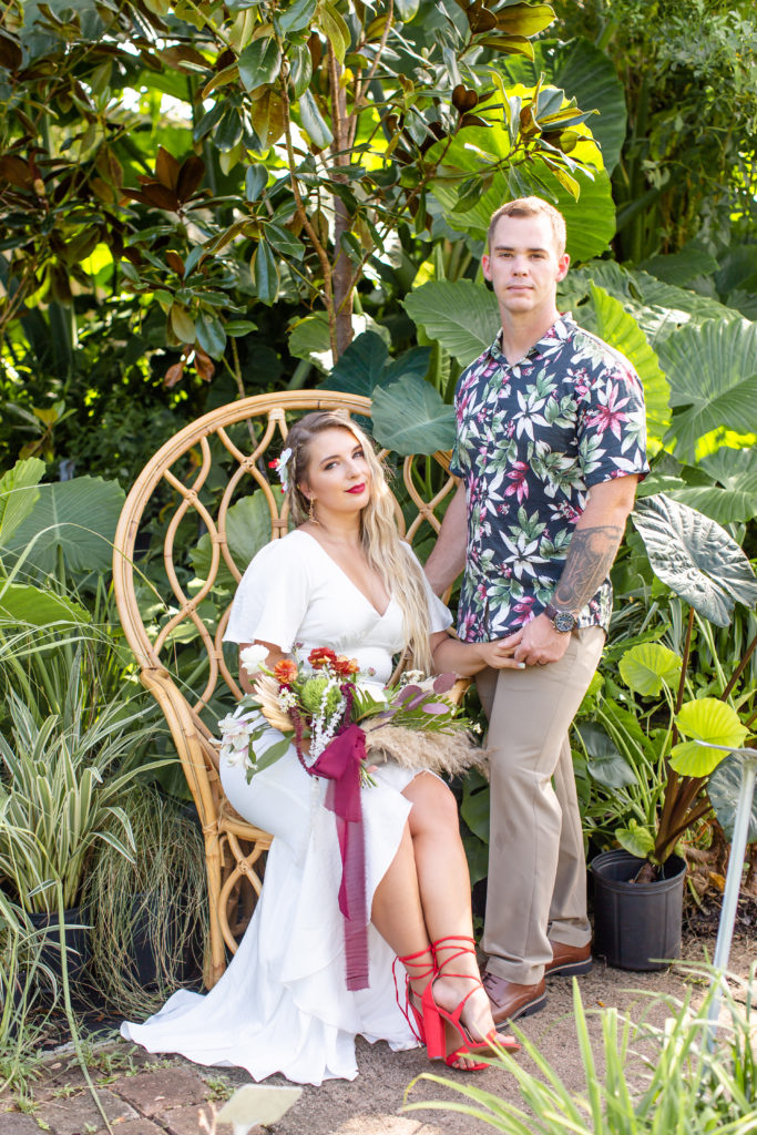Young couple poses for tropical wedding photos on Anastasia Island