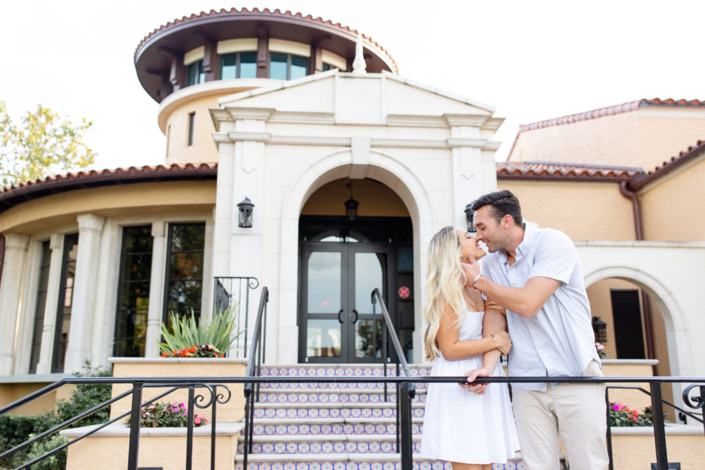 Rollins College engagement photos — woman wears white dress and man wears button-down collared shirt