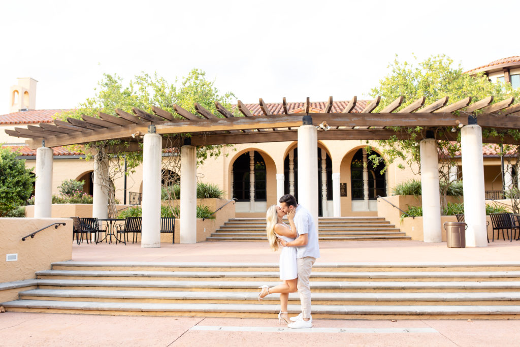 Rollins College engagement photos with a couple kissing in front of some steps