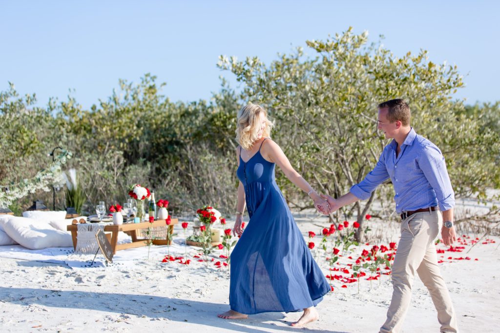 Florida Beach Proposal Photos - New Smyrna Dunes Park Proposal — Surprise Beach proposal with pop up picnic and rose petals on the beach