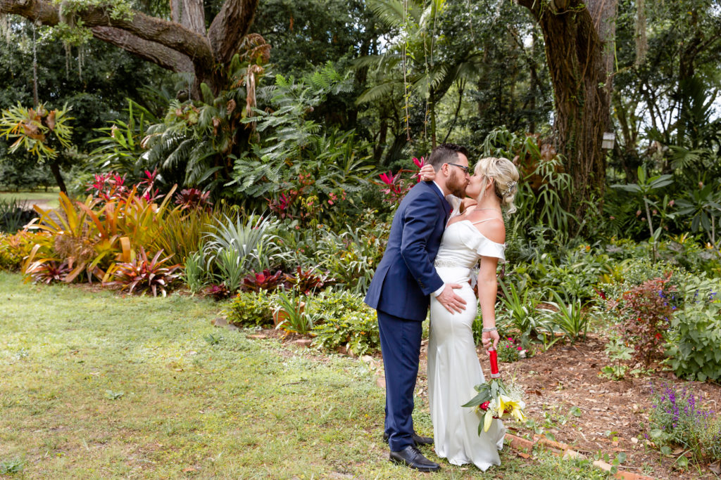 Mead Botanical Garden Elopement Wedding Photo — Bride and Groom kissing in the tropical garden
