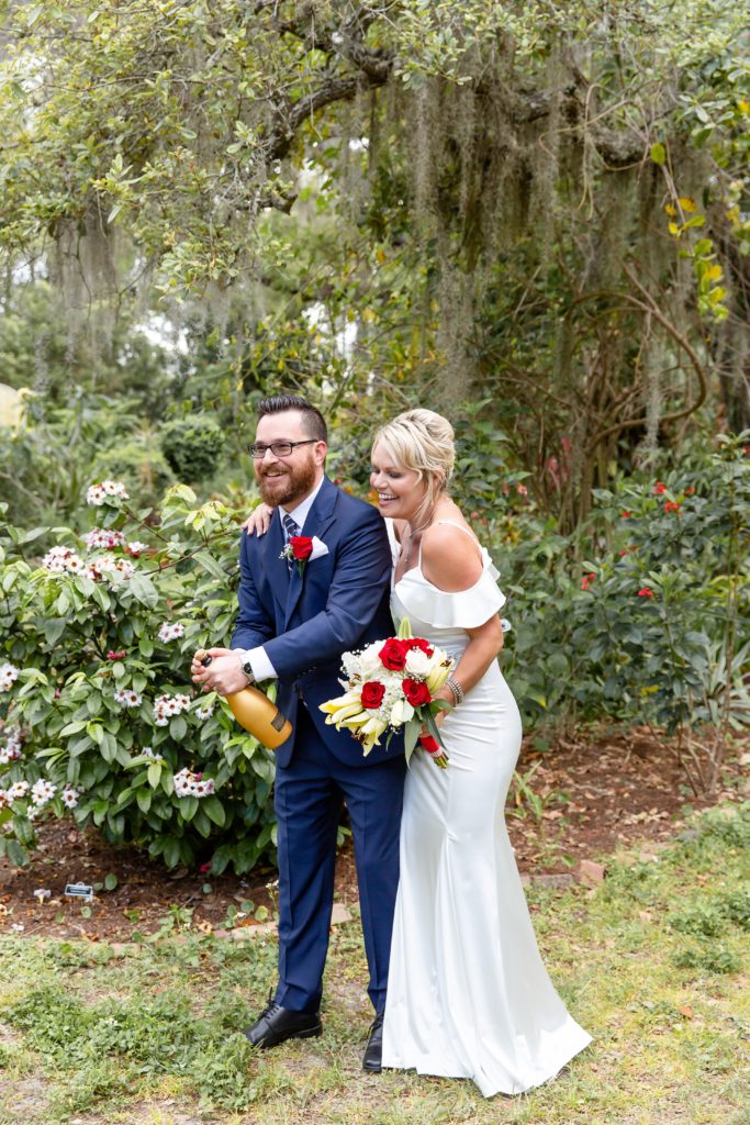 Mead Garden Wedding Photo — Bride and Groom popping champagne in the tropical garden