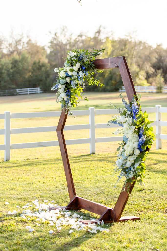 Hexagon Wedding Arch with white and blue floral accents at Bramble Tree Estate in Orlando, FL