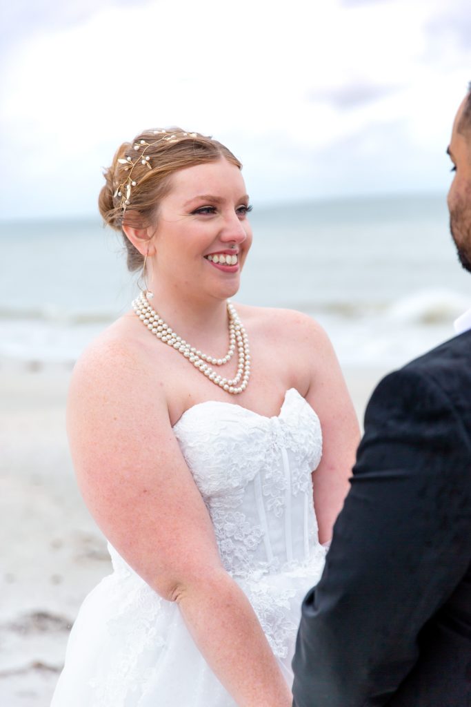 Bride saying vows in beach elopement