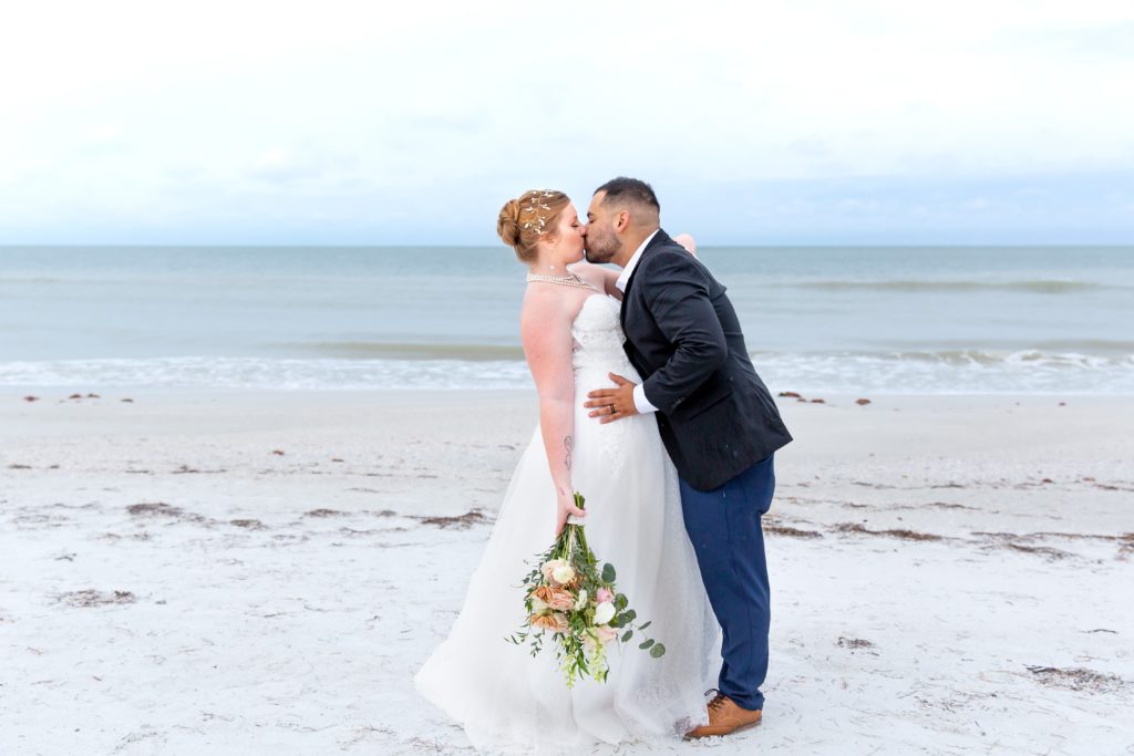 Bride & Groom kissing on the beach after Treasure Island Elopement
