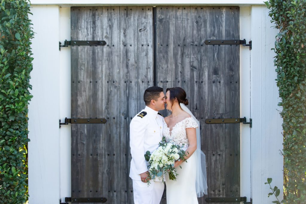Bride & Groom laughing in front of doors at Bramble Tree Estate in Orlando, Florida