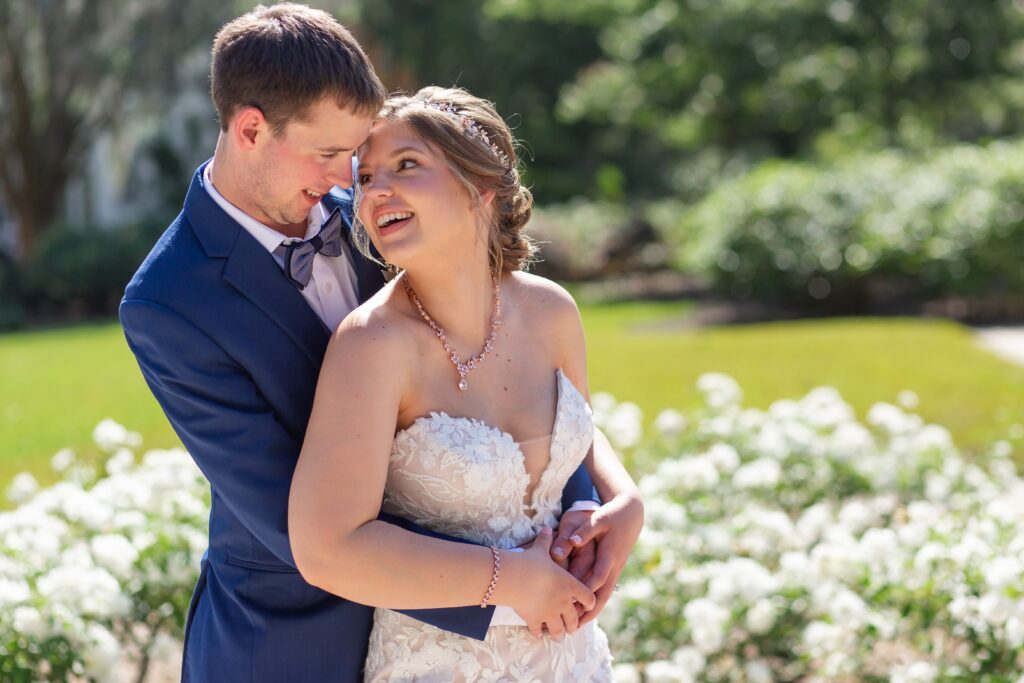 Bride and Groom laughing in the rose garden at Leu Gardens Orlando after their elopement