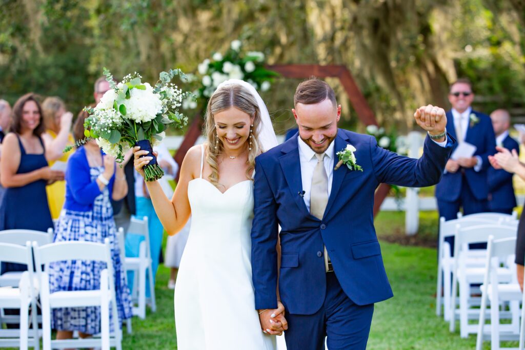 Bride and Groom celebrate after micro wedding ceremony at Bramble Tree Estate in Orlando, Florida