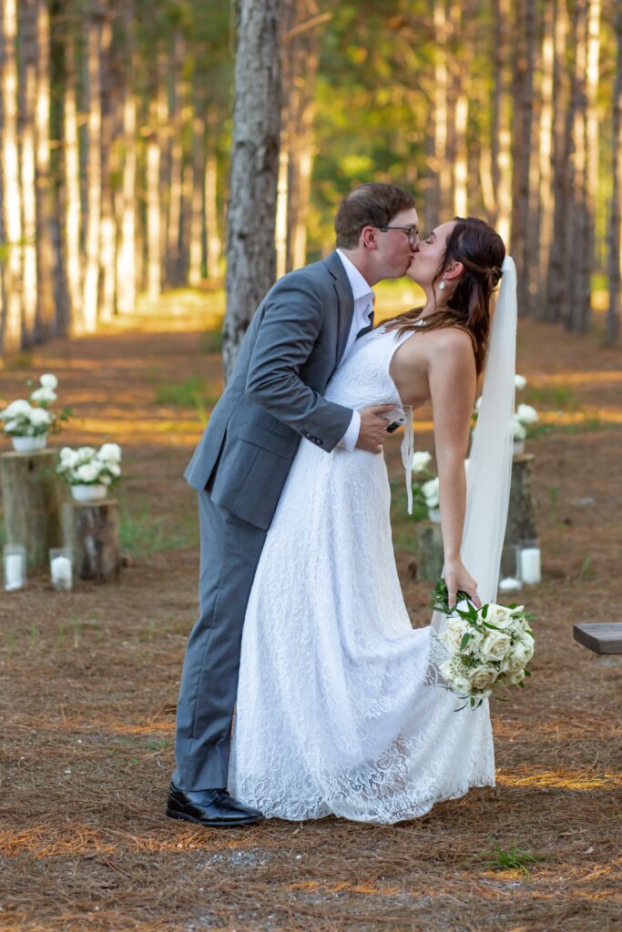 Bride and Groom first kiss at Forest Wedding in Florida