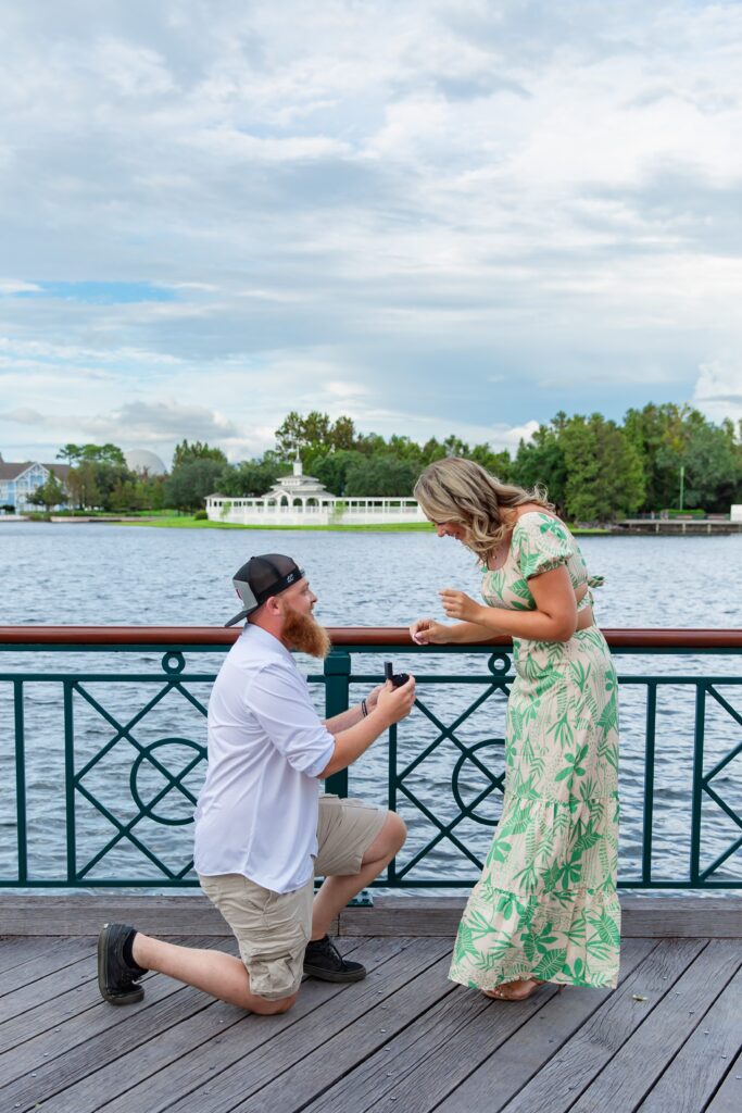Guy proposes to girl at Disney's Boardwalk in front of the water