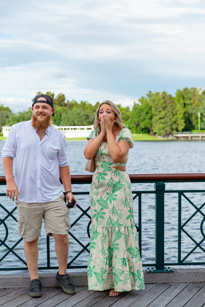 Girl shocked after Disney Proposal at the Boardwalk in front of the water