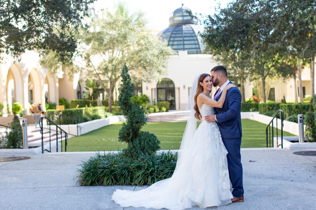 Groom kisses Bride on their wedding day at the Alfond Inn in Winter Park, Florida