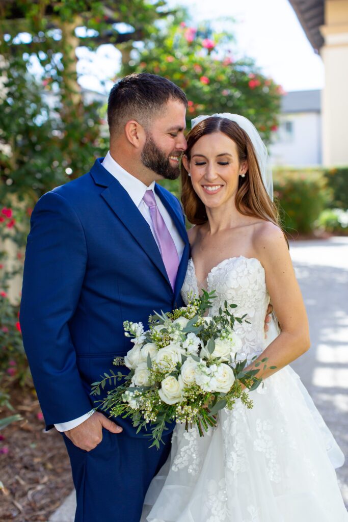 Groom snuggles into Bride on their wedding day at the Alfond Inn in Winter Park, Florida