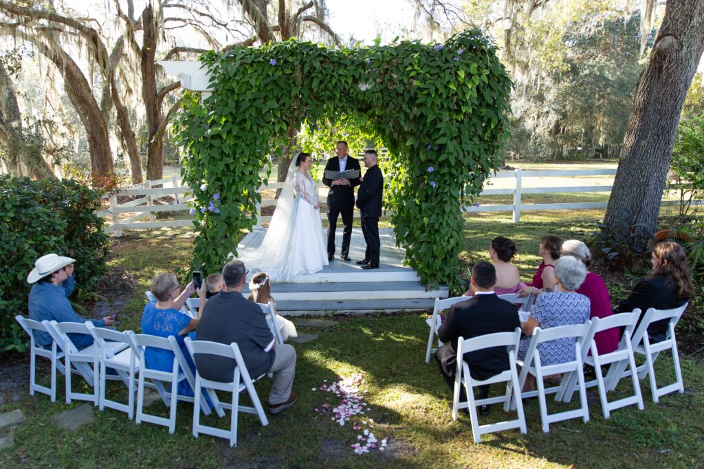 Intimate wedding ceremony in the secret garden at Bramble Tree Estate in Orlando, Florida