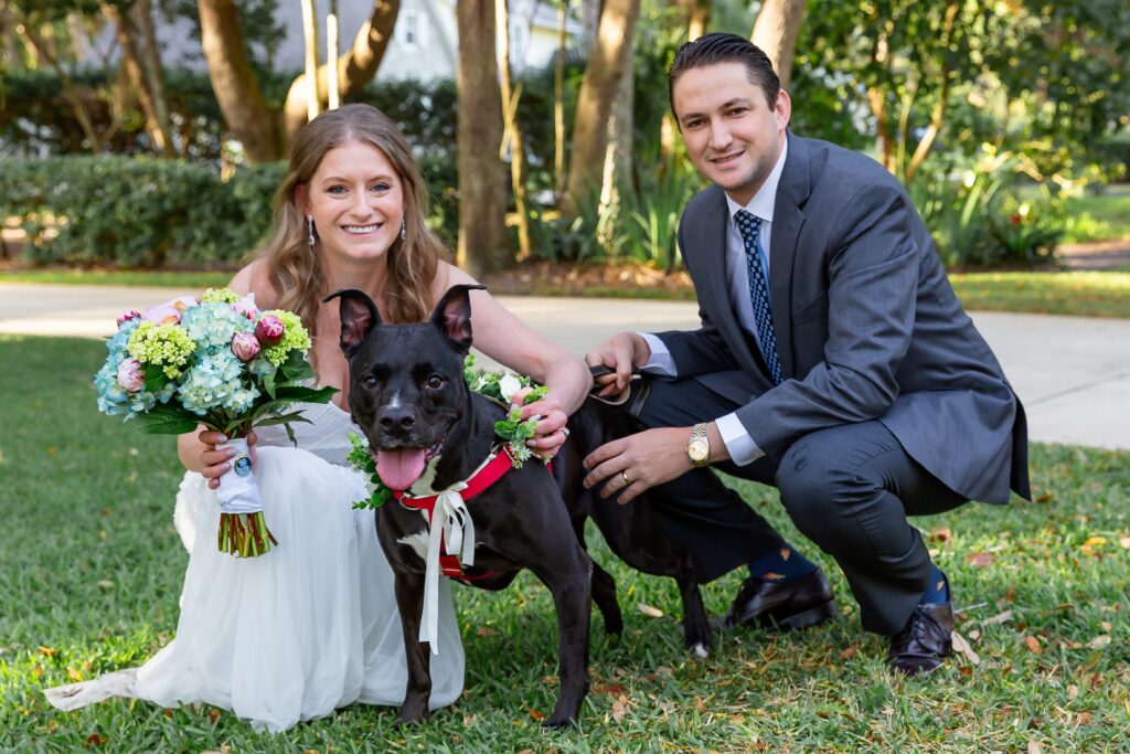Bride and Groom pose with their dog at their back yard wedding in Orlando, Florida