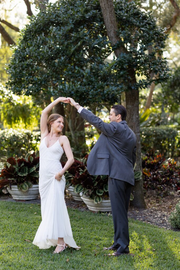 Groom twirls Bride at their back yard wedding in Orlando, Florida