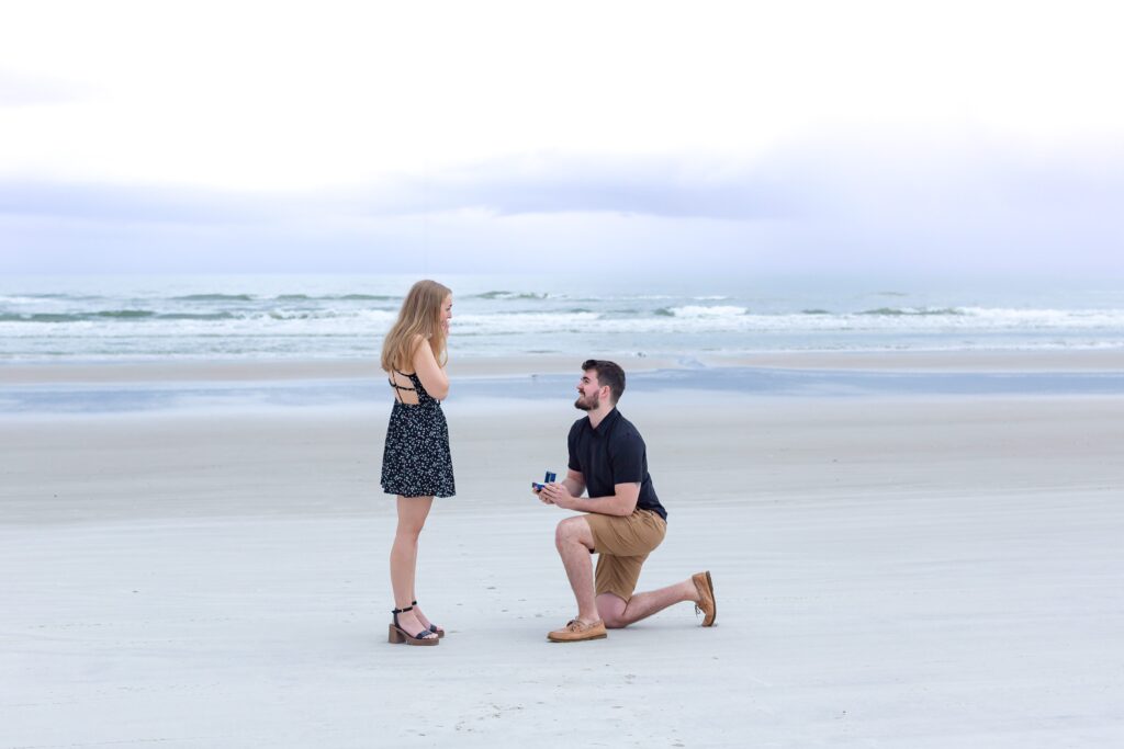 New Smyrna Beach Photos - Guy gets down on one knee and proposes to girlfriend at New Smyrna Beach Florida