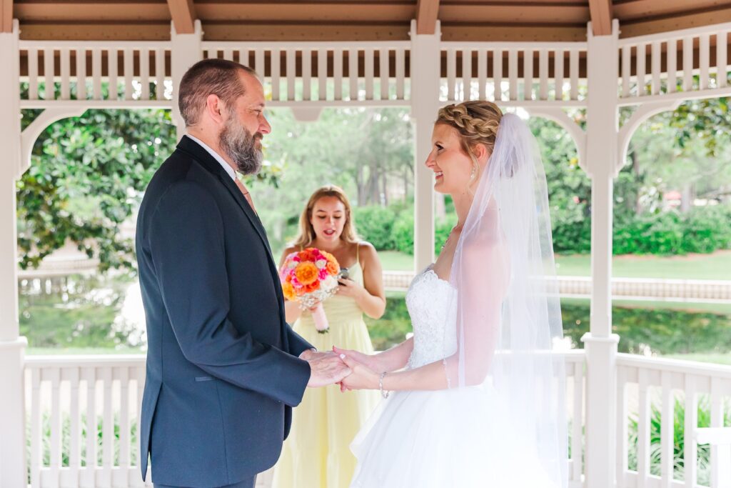 Bride and Groom say their vows in their Disney Elopement at Disney's Port Orleans Riverside Resort