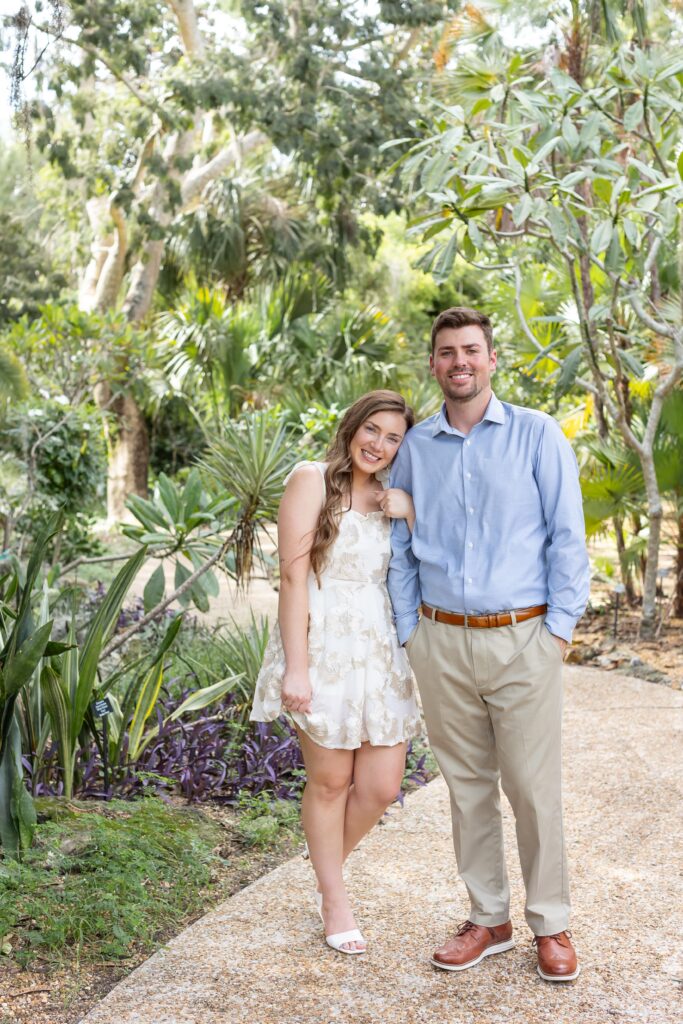 Couple poses after their proposal at Leu Botanical Garden in Orlando, FL