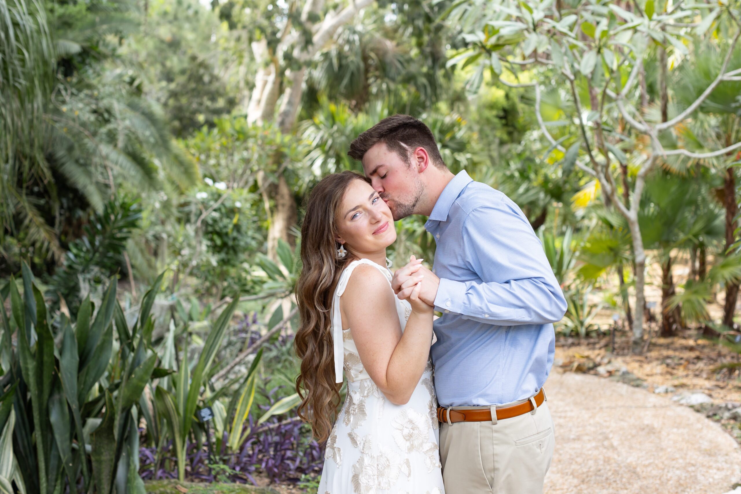 Guy kisses girl after their proposal at Leu Botanical Garden in Orlando, FL