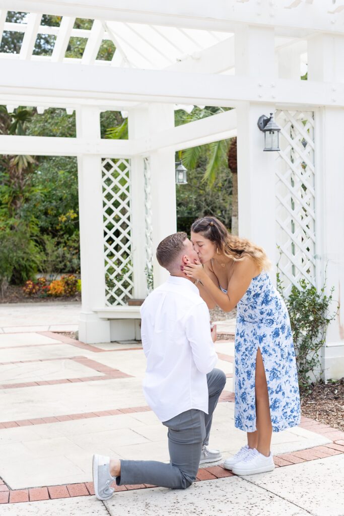Guy proposes to girl in the idea garden at Leu Botanical Garden in Orlando, Florida