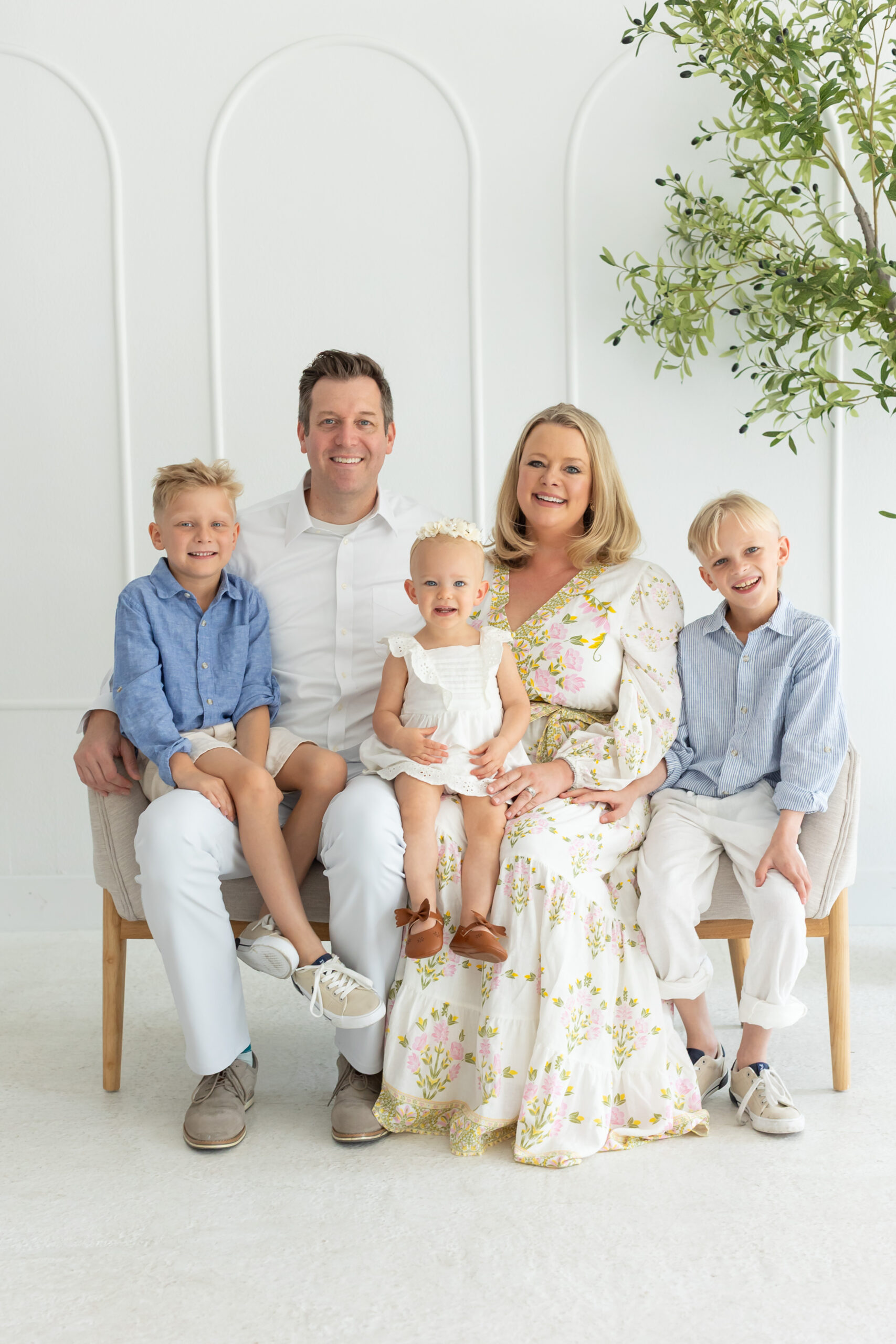 Family poses for their studio family portraits in Orlando at the Brand Studio in Longwood, Florida