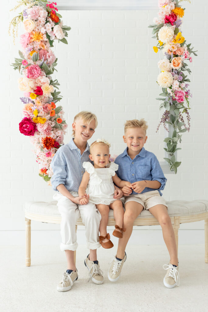 Kids pose for their studio family portraits in Orlando at the Brand Studio in Longwood, Florida