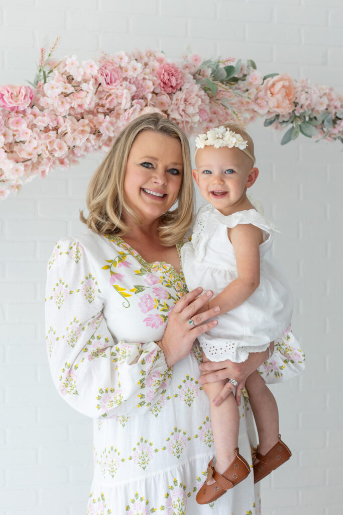 Mother and Daughter pose for their studio family portraits in Orlando at the Brand Studio in Longwood, Florida