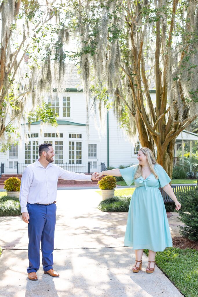 Couple dances for their engagement photos at Leu Gardens in Orlando Florida