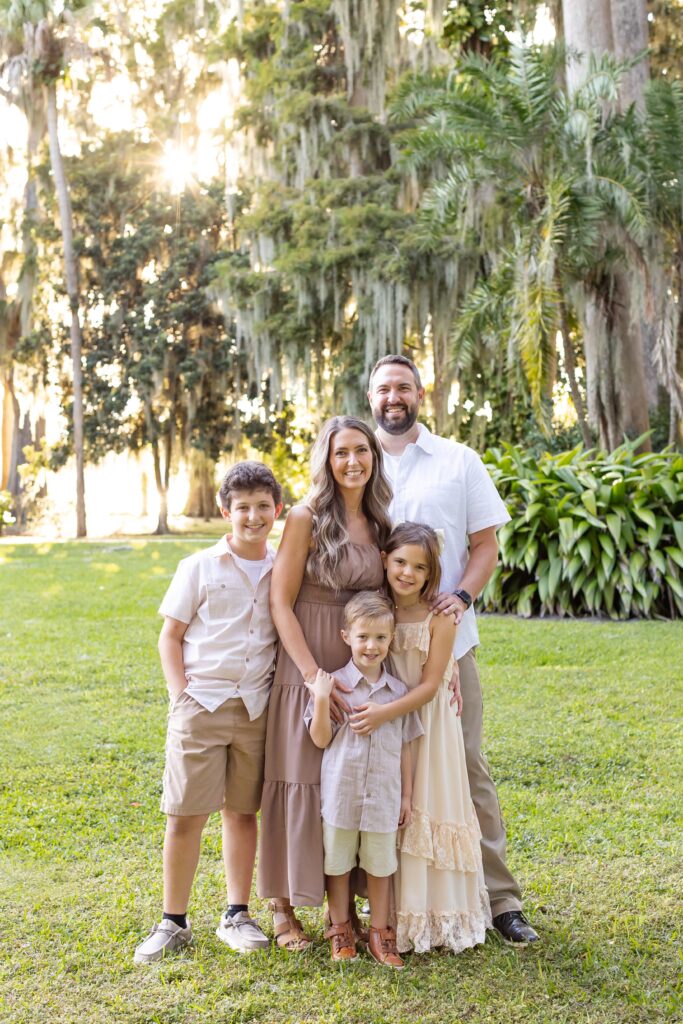 Family smiles for their Kraft Azalea Gardens Family Photo Session in Winter Park, Florida