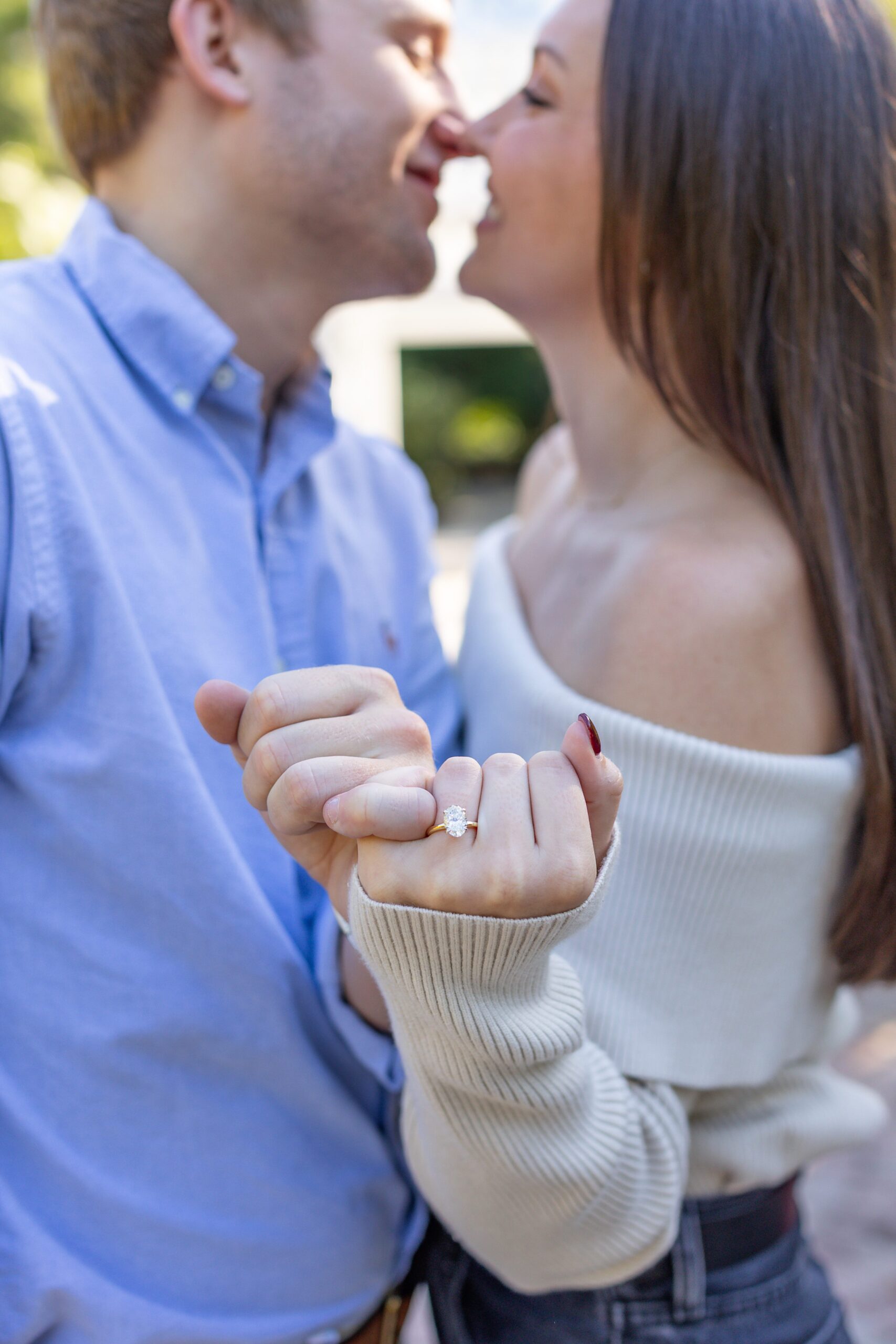 Girl shows off ring after her proposal in Orlando at the idea garden at Leu Gardens
